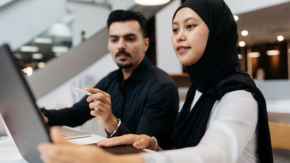 Asian business people working together in modern office